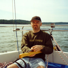 Photographer Bill Moe at Fretnaught's helm